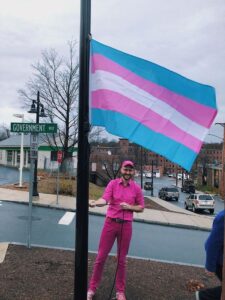 Emmett Soldati raising the Trans flag